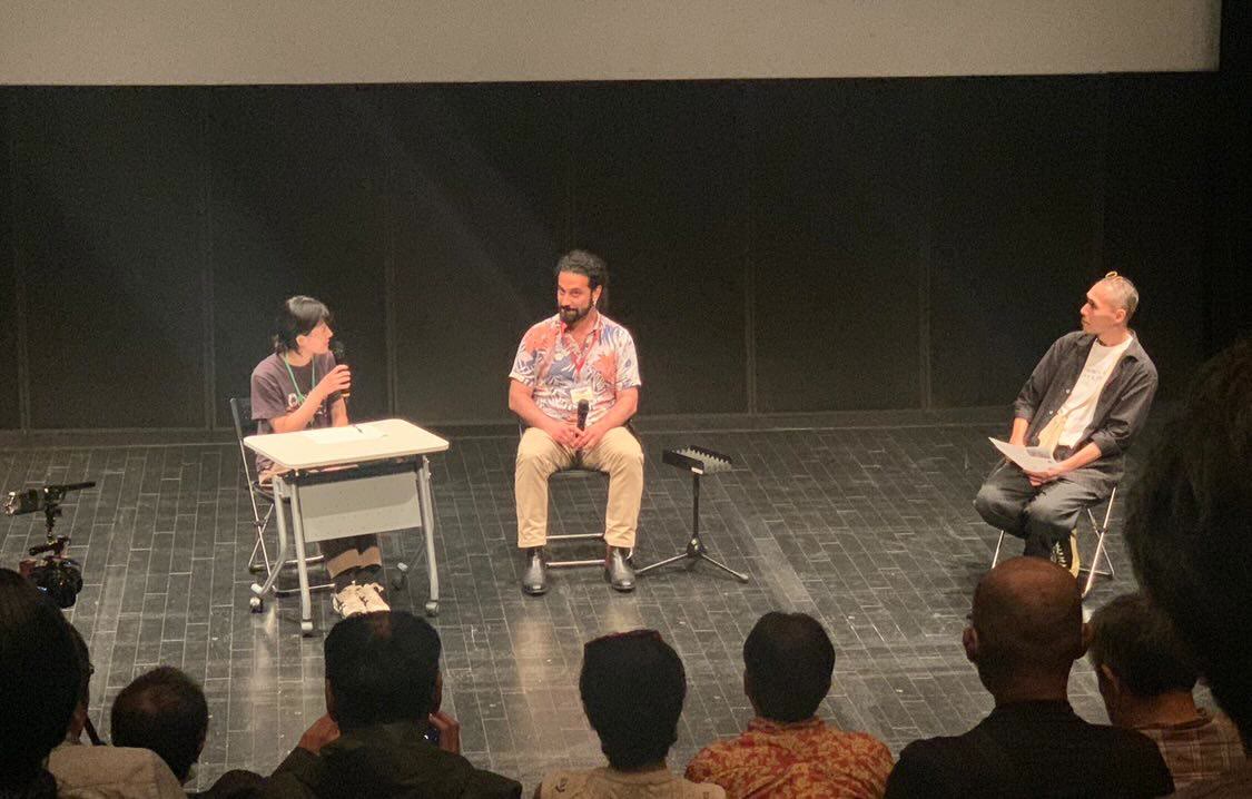 Mani Nickpour on stage during a Q&A at the Kanazawa Film Festival