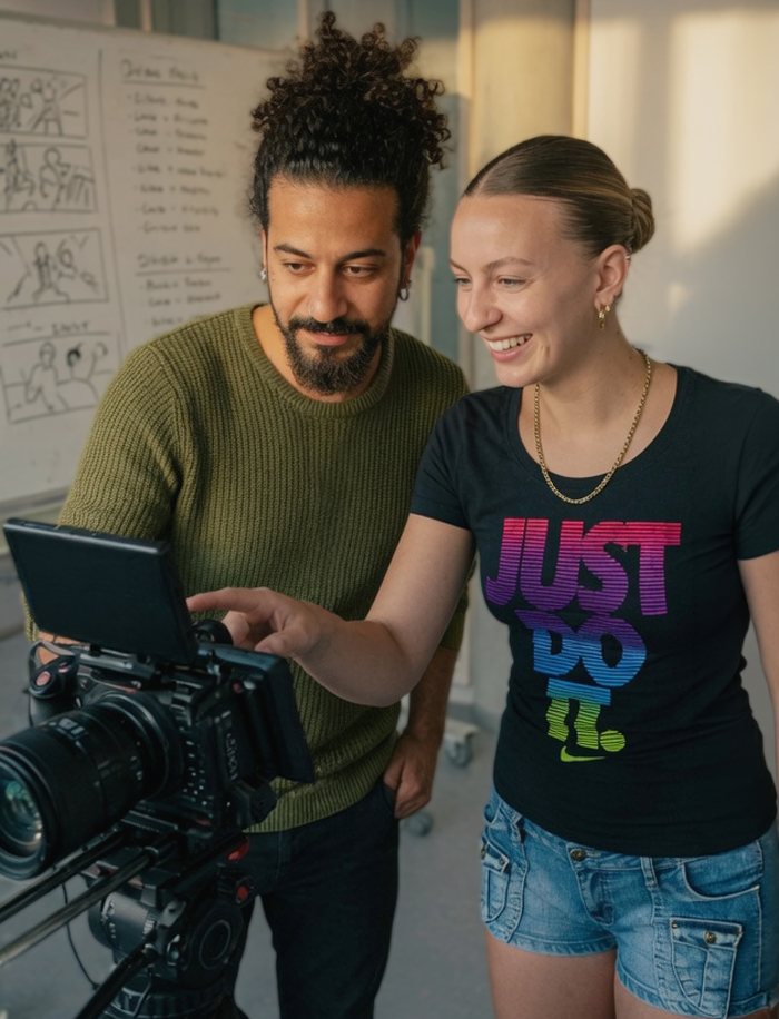 Mani with a student at a cinema camera